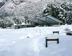 The start of the Routeburn in a bit of snow. These are the toilets. The Falls hut is further in and higher up.. The start of the Routeburn in a bit of snow. These are the toilets. The Falls hut is further in and higher up..